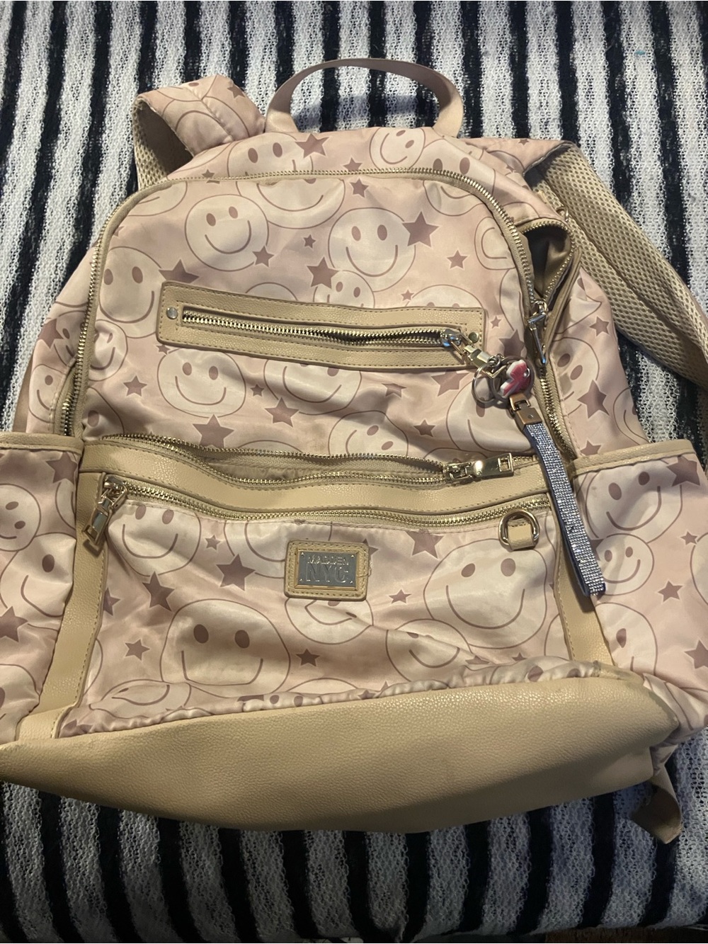 Madden NYC smiley faced back pack with gold hardware , beige & brown 9 pockets z